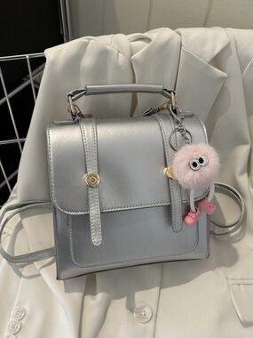Silver Mini Crossbody Satchel with Pink Pom Pom Charm